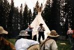 Helen and Warren 'Hawk' Boughton, Helen playing fiddle while Hawk recites poetry at the 'Big Hole',  Montana Rendezvous, 1996, near Jackson, Montana